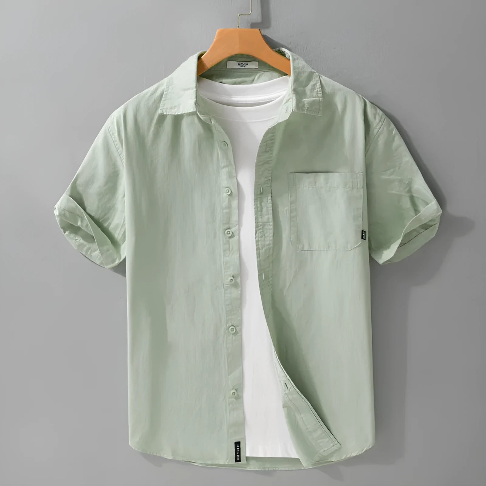 Men's loose-fit pure cotton short sleeve shirt in light blue, showing casual cardigan style.