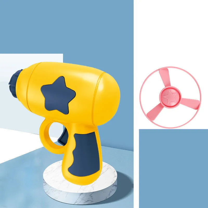 Blue flying saucer launcher gun and three LED flashing discs on a yellow background.
