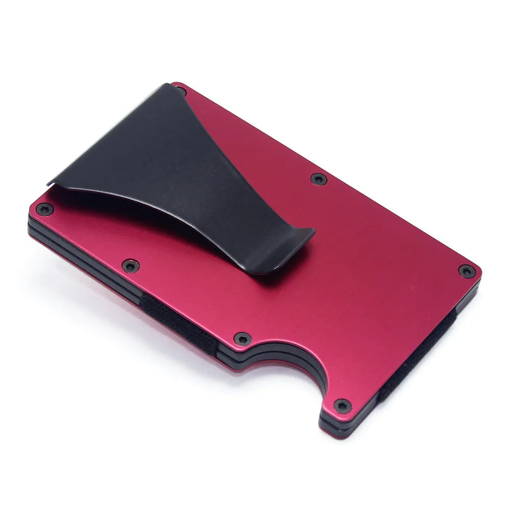 A slim carbon fibre card holder wallet in a geometric design, shown with business cards.