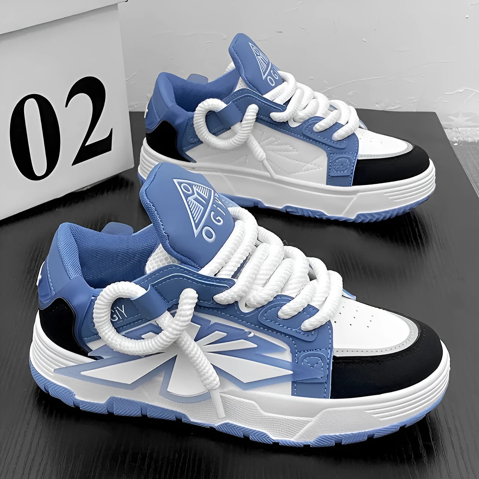 Men's white clunky casual sneakers with cartoon totem pattern, round toe, and lace-up front on a rubber sole.