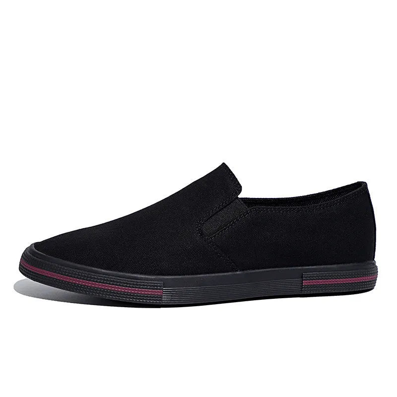 Khaki coloured canvas low-top slip-on sneakers with vulcanised rubber soles and a round toe.