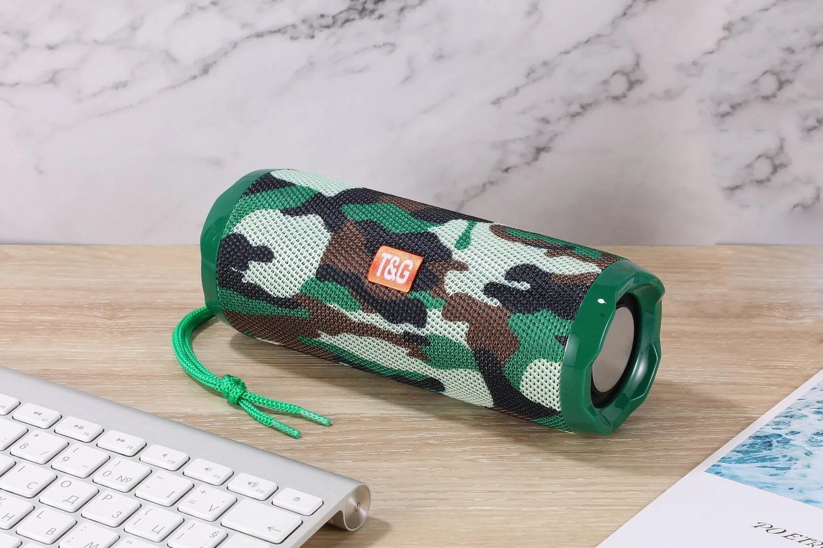 Fabric portable Bluetooth speaker with integrated card holder in multiple colour options.