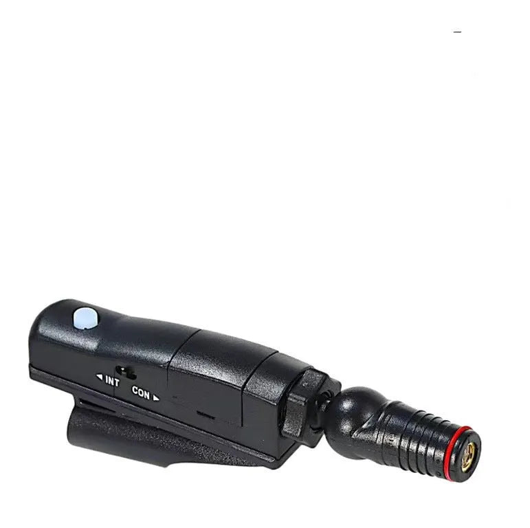 Golf putter laser aiming instrument on a putting green, showing laser alignment line.