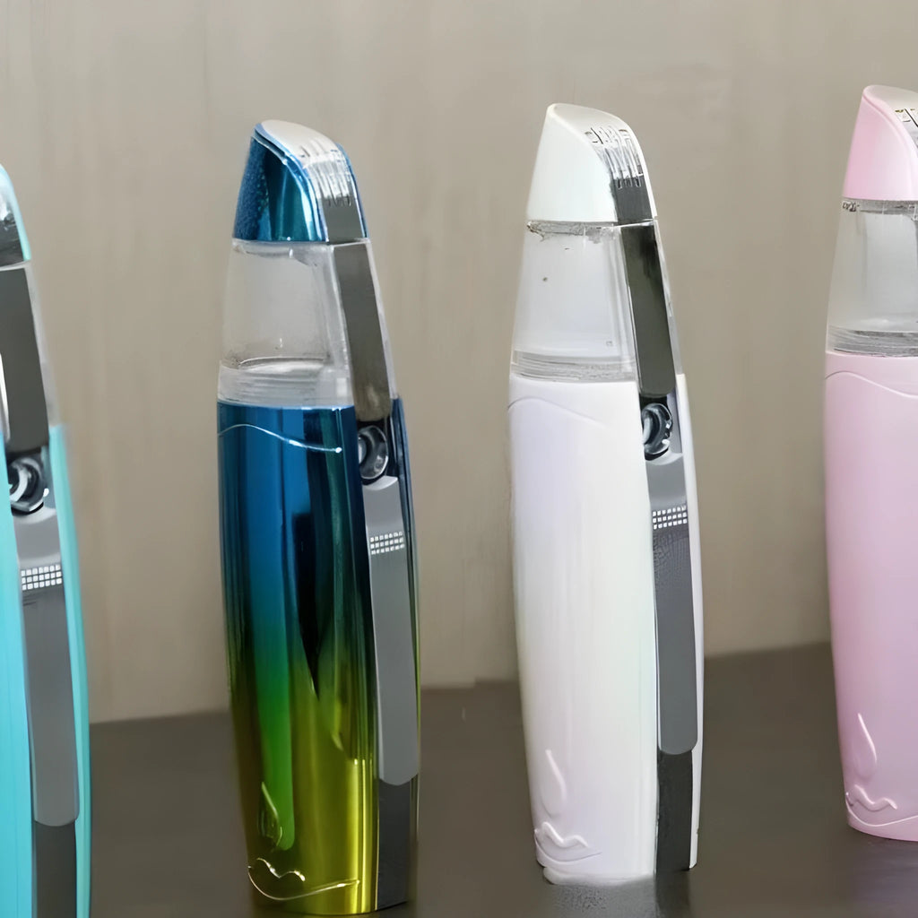 Peacock blue USB rechargeable handheld facial steamer producing hydrogen-rich water mist