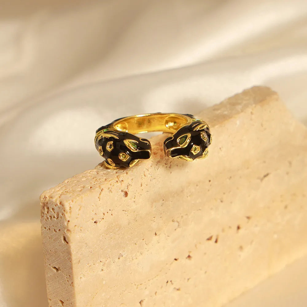 Women's geometric copper ring with electroplated black cheetah pattern design