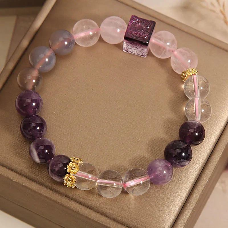 Women's purple amethyst crystal bracelet with rhinestone details measuring 10mm