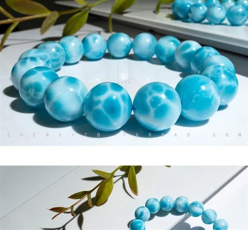 Blue Bodhi bracelet with natural sea-pattern crystal stones and pearl details in Maillard style.