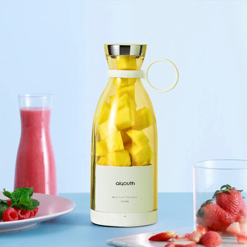 Handheld portable mini juicer in pink with USB charging cable and automatic cleaning function