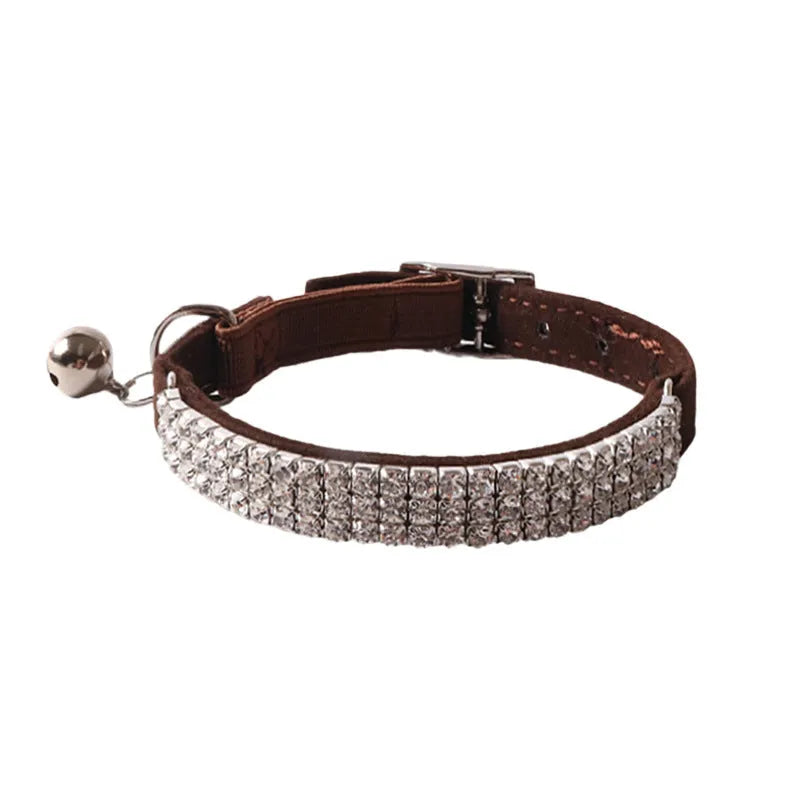 Elastic buckle cat collar with flocking material in gang drill design, shown in multiple colours.