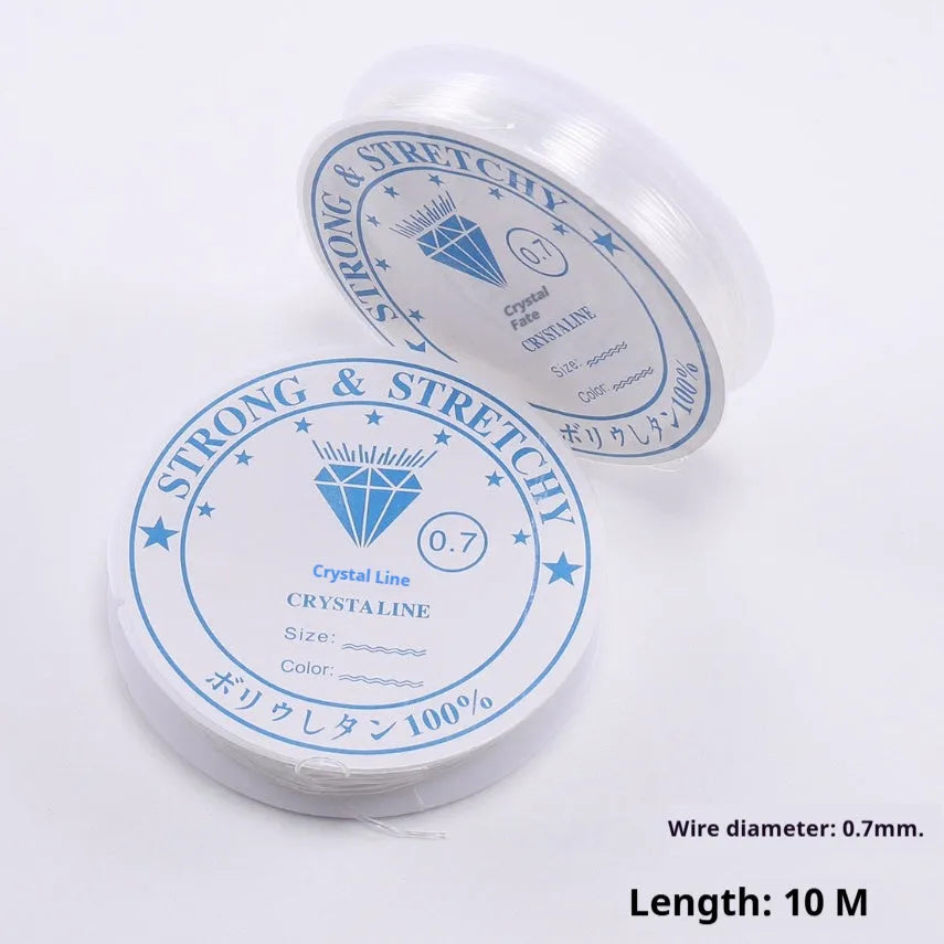 Coil of transparent white elastic fishing line cord for DIY jewellery and ornament making.