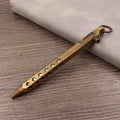 Brass tactical pen with bolt mechanism and six-ring grip pattern
