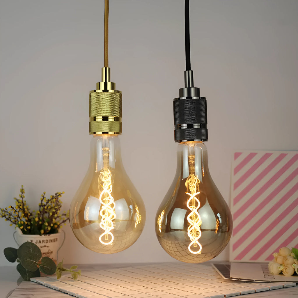 Double helix LED filament bulb in gold finish with spiral design visible through glass housing
