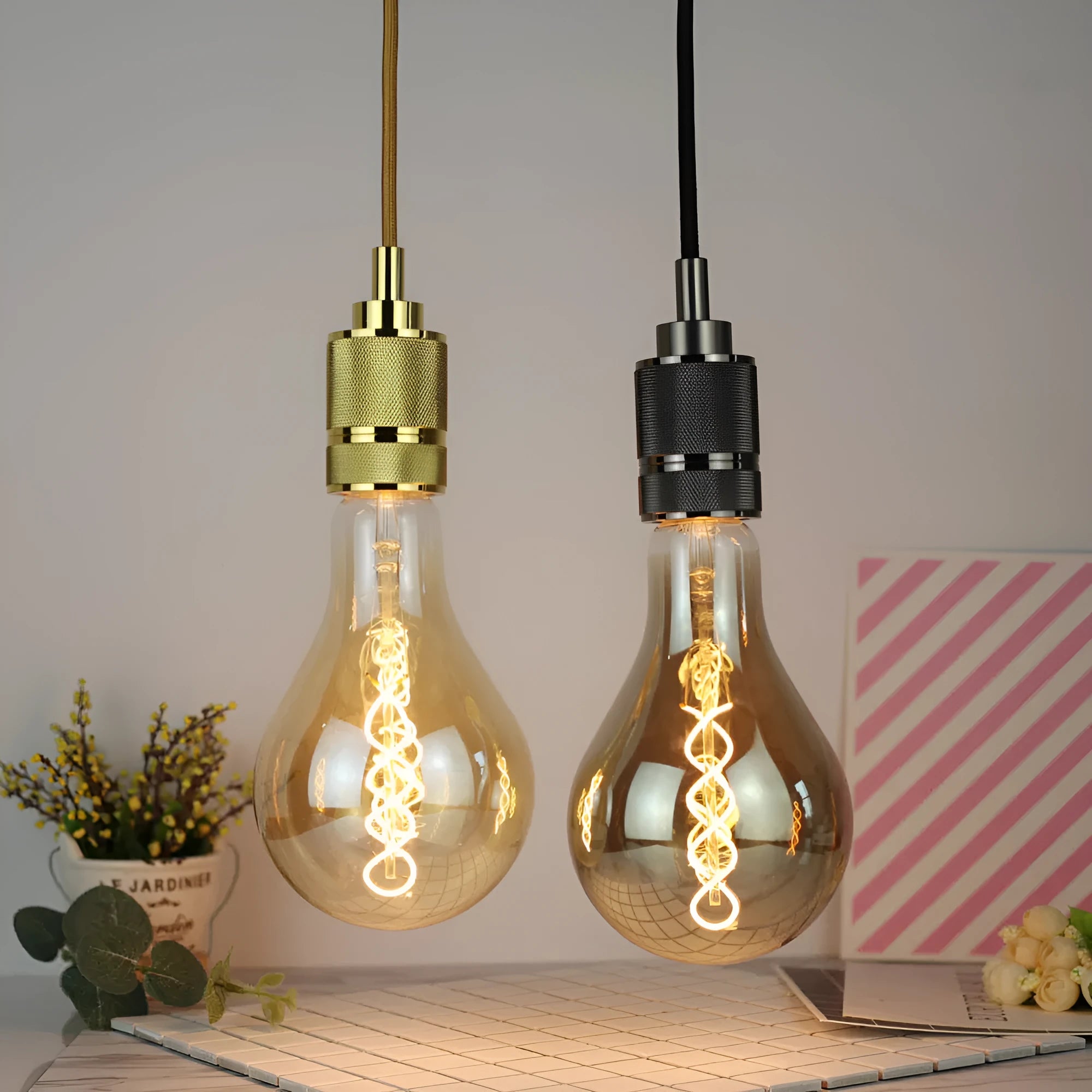 Double helix LED filament bulb in gold finish with spiral design visible through glass housing