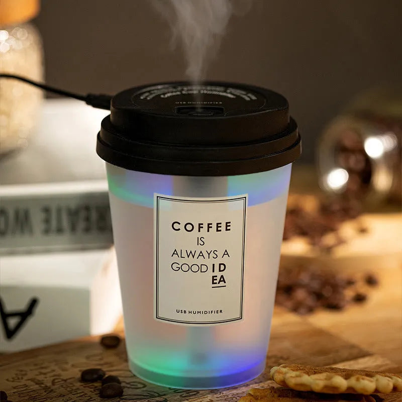 Mini horse USB humidifier aroma diffuser with transparent tank, black cover, and single fog nozzle on desk