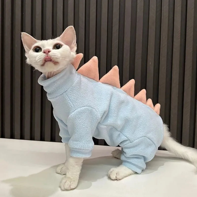 Sphynx cat wearing dinosaur costume with spikes and tail in soft fleece material