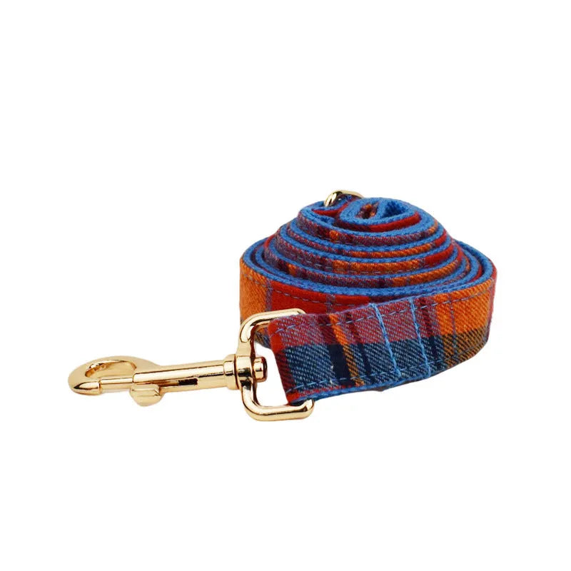 Four-piece dog fashion set showing collar, leash, bow tie and vest in coordinated cloth material
