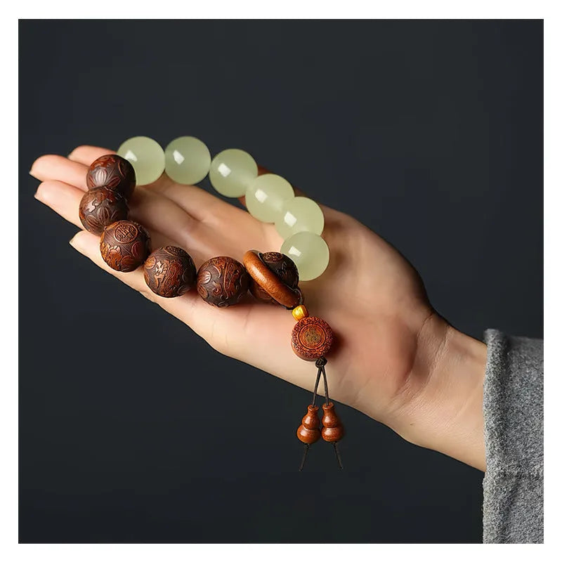 Wooden Fu character bracelet with twelve 20mm rosewood beads on flexible rings