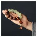 Wooden Fu character bracelet with twelve 20mm rosewood beads on flexible rings