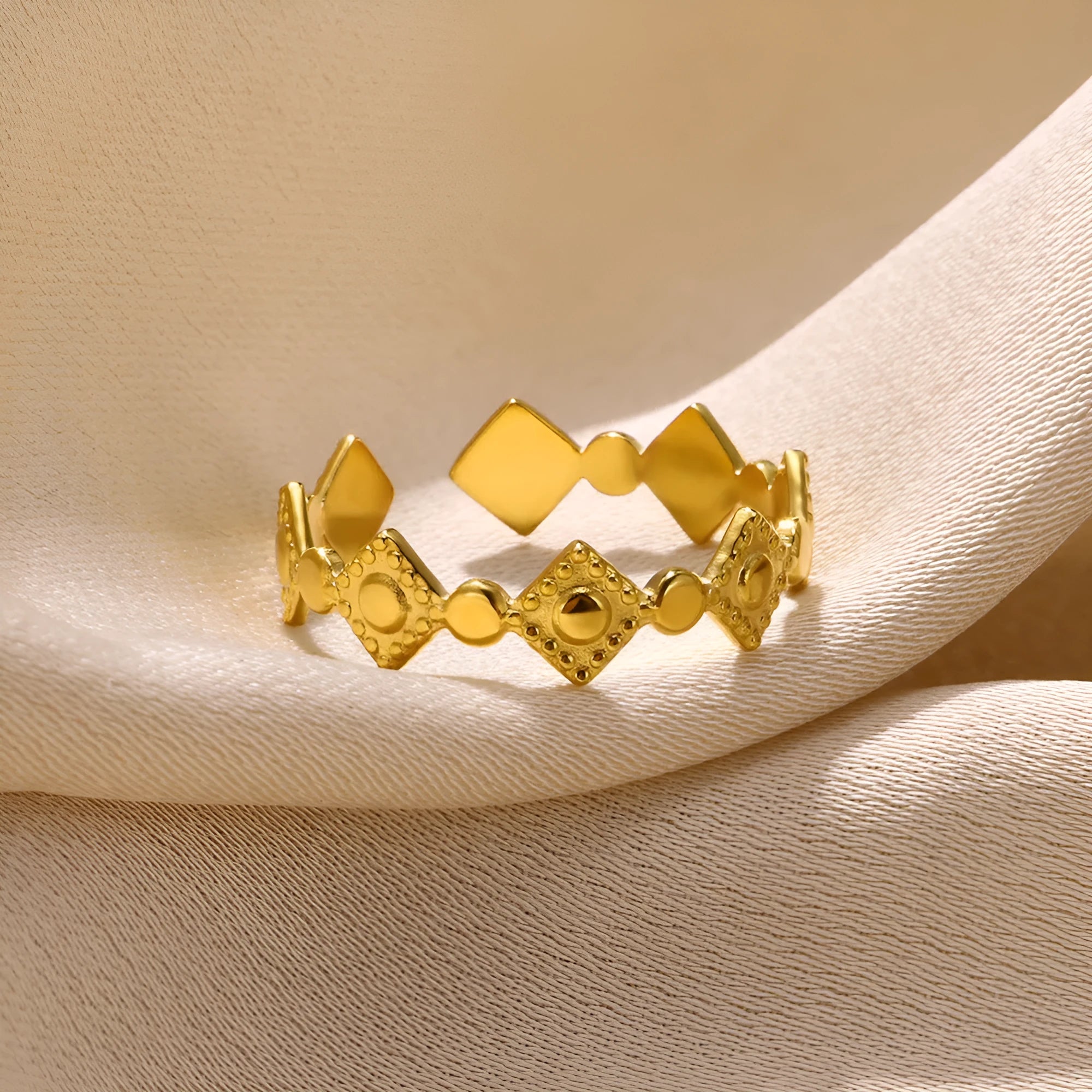 Gold-coloured geometric titanium steel women's ring with diamond detailing