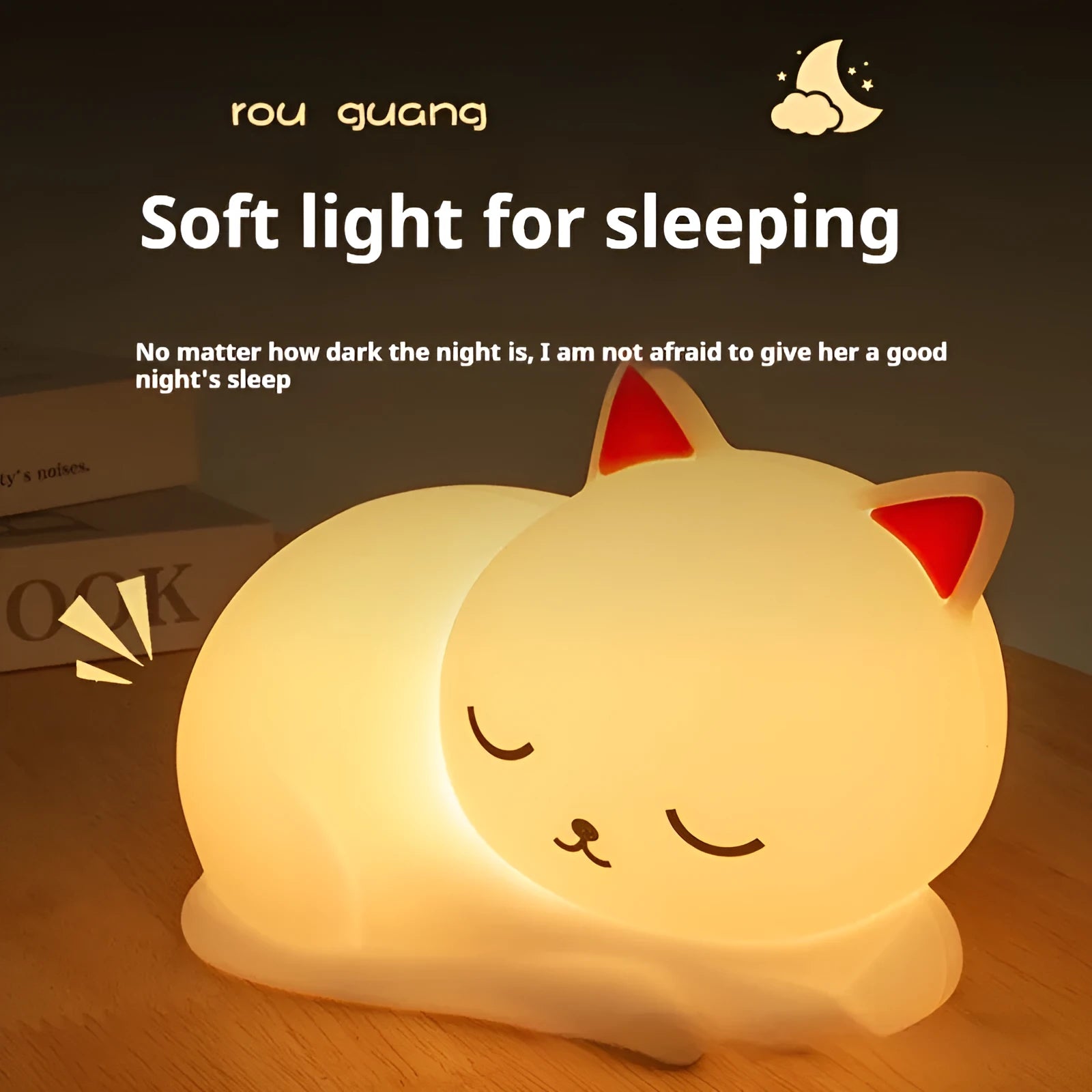 Sleepy cat silicone night light with warm white glow, induction pat feature, on a bedside table