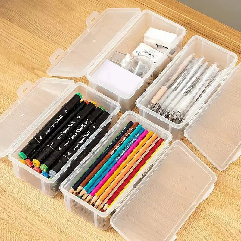 Large clear plastic stationery storage box filled with coloured pencils and crayons
