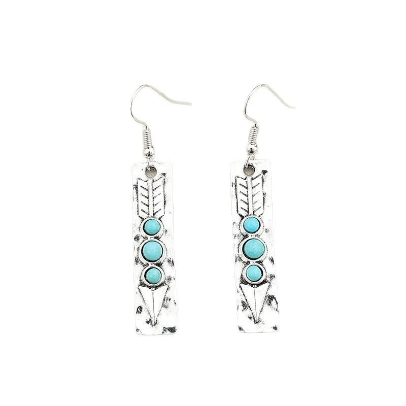 Silver geometric earrings with turquoise inlay in long strip design