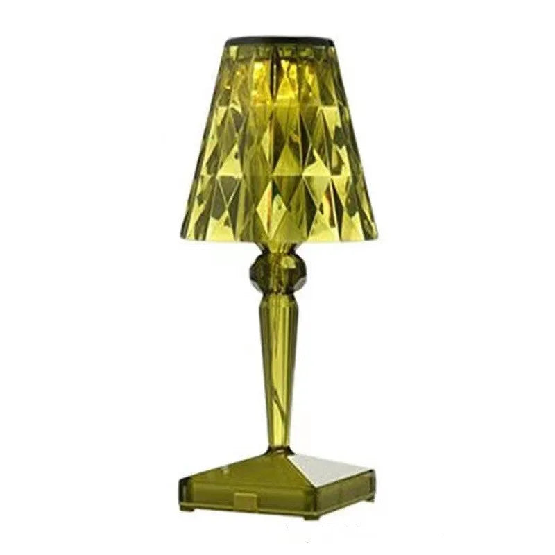 Rose gold plated portable touch night light with rechargeable battery on a table.