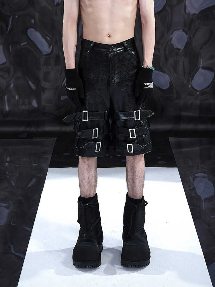 Men's black PU leather casual cropped pants with a medium-low waist on a model.