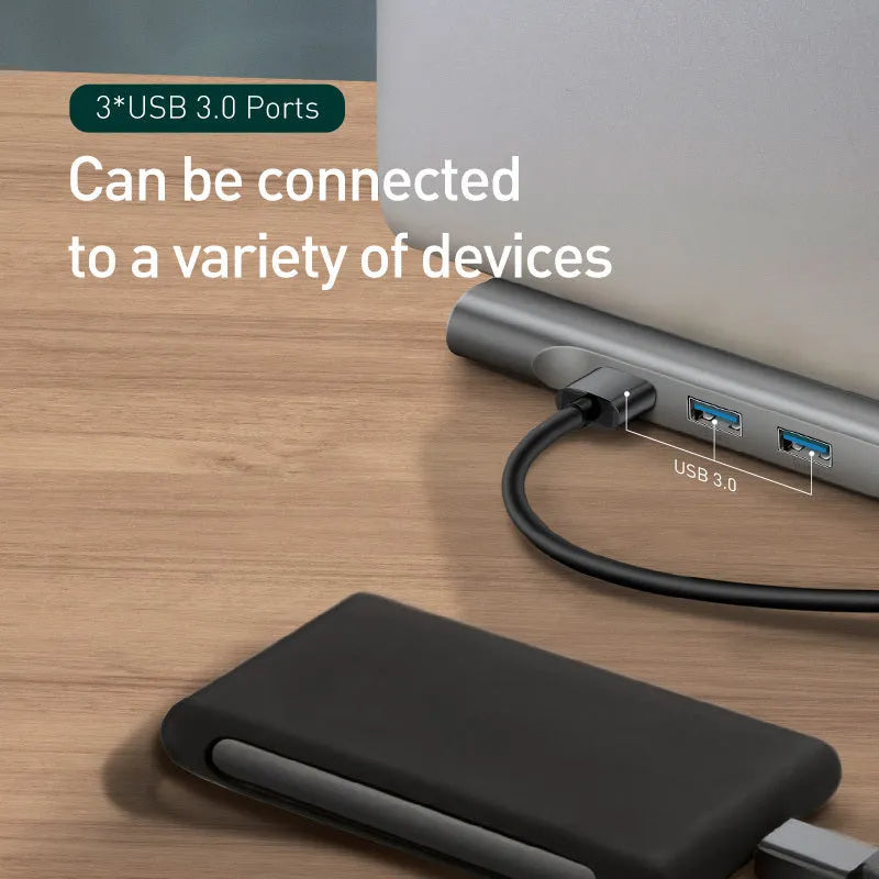 Aluminium USB-C docking station with cooling bracket showing ten ports including HDMI and VGA connections