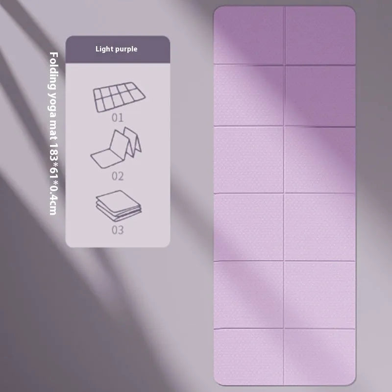 Blue foldable TPE gymnastic mat unfolded on floor showing non-slip texture and dimensions.