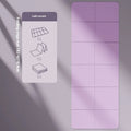 Blue foldable TPE gymnastic mat unfolded on floor showing non-slip texture and dimensions.