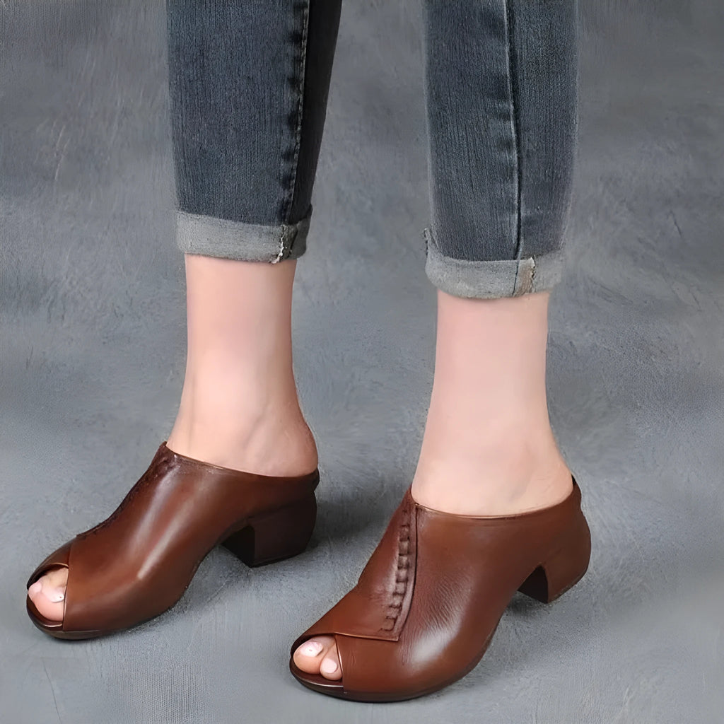 Women's black square heel peep-toe slippers showing fish mouth scaffold design and rubber sole