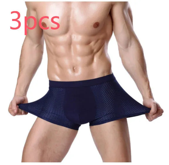 Men's solid colour ice silk modal boxer briefs with U convex design and mid-waist fit.