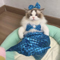 Blue pet mermaid costume with scale pattern on a cat, showing elastic chest strap and long fishtail.