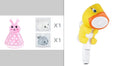 White and blue whale-shaped bath toy spraying water with LED lights on, floating in a baby bath
