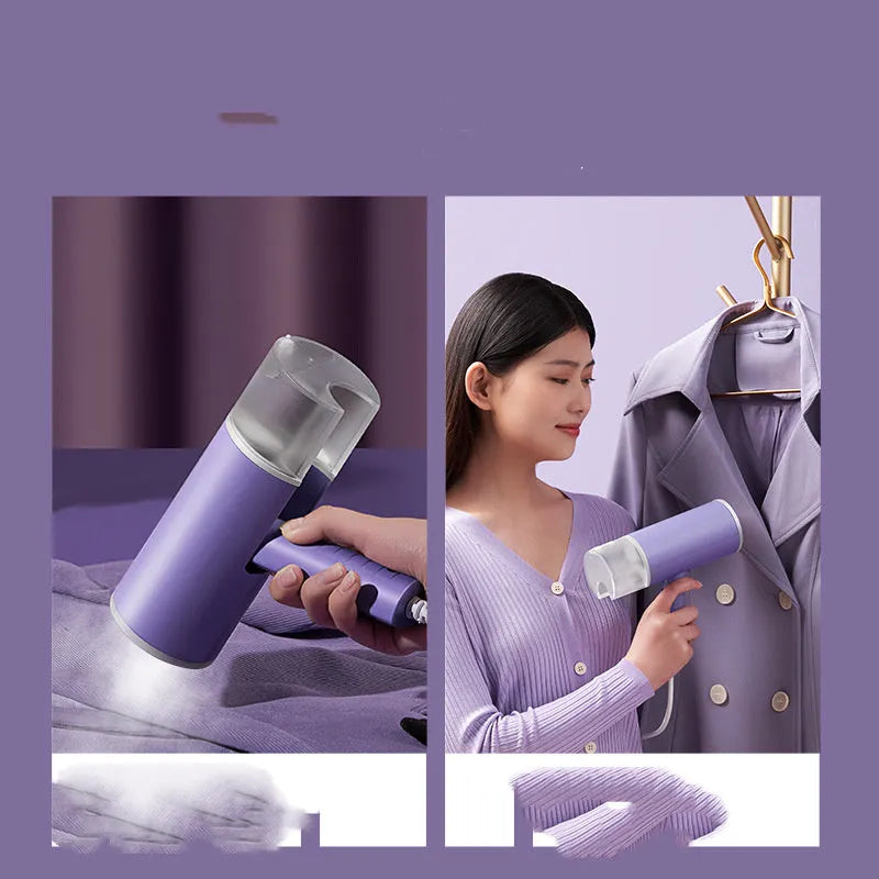 Foldable handheld clothes steamer in grey lotus root purple on a table.
