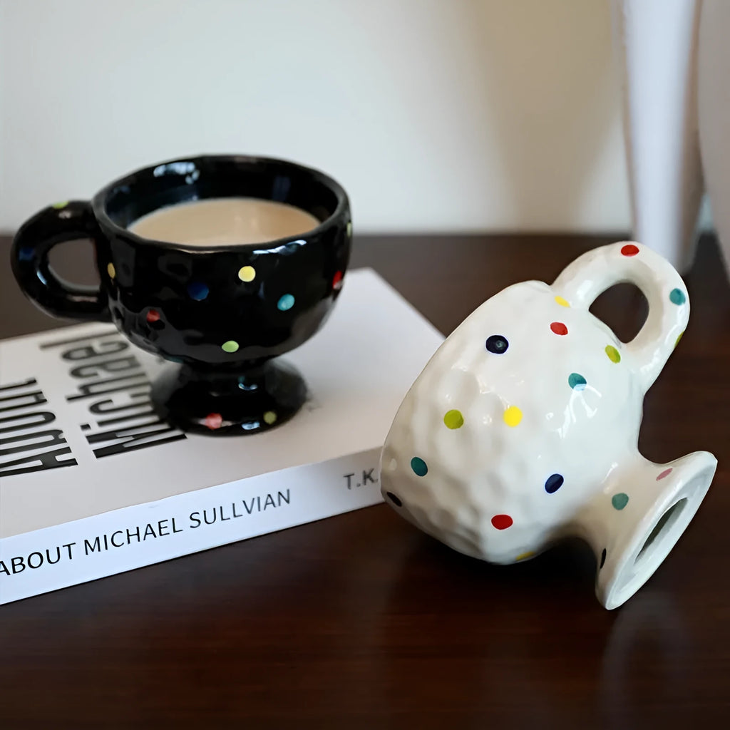 Hand-pinched irregular ceramic mug showing solid colour and unique shape