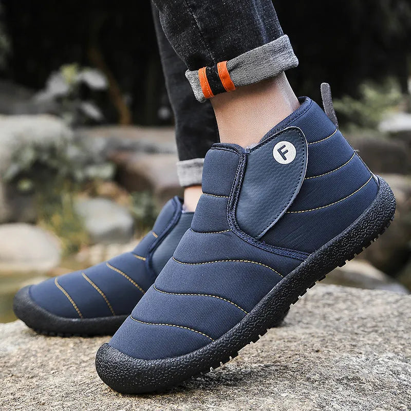 Men's waterproof snow boots in black with non-slip rubber soles and cotton upper