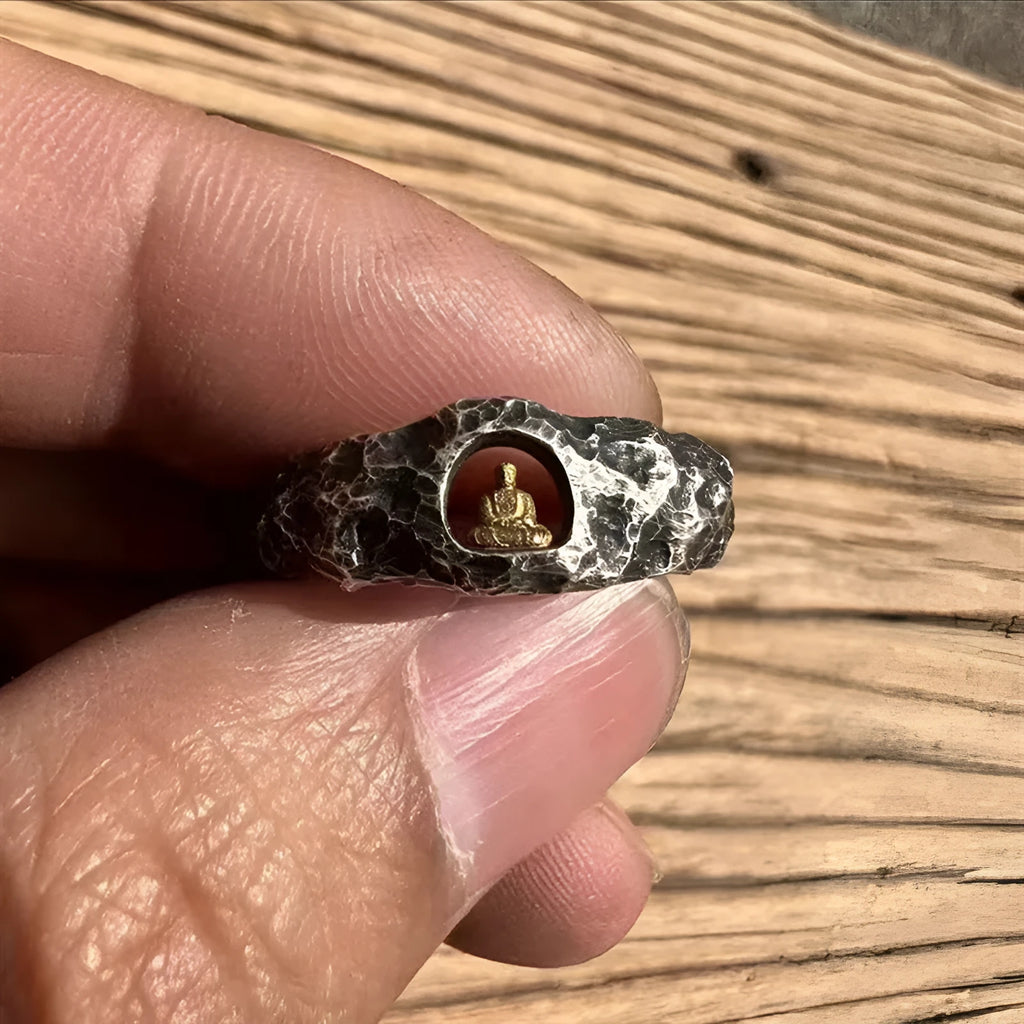 Hand-forged copper Grotto Buddha ring with rock texture on a size No. 8 finger.