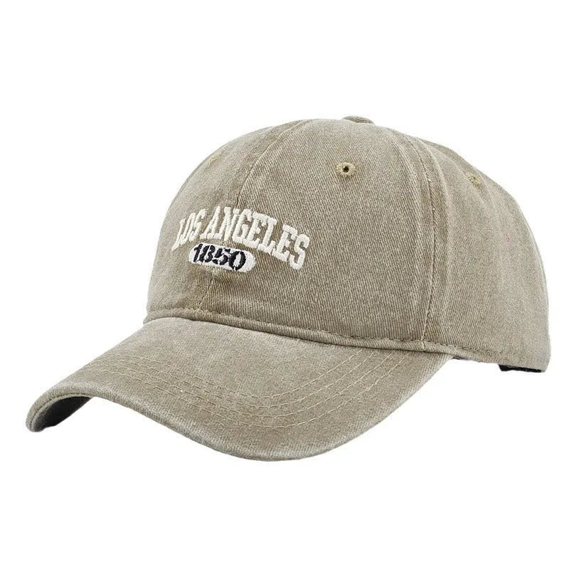 Retro personalised peaked cap with letters embroidery in beige, adjustable strap visible.