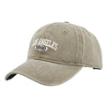 Retro personalised peaked cap with letters embroidery in beige, adjustable strap visible.