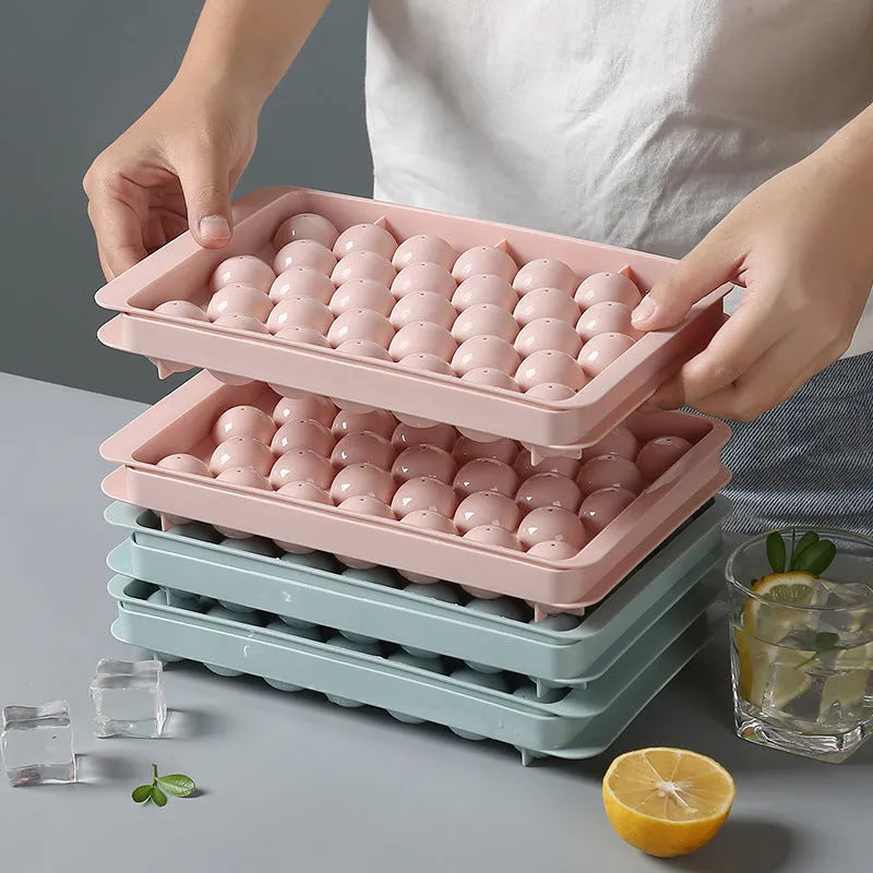Sky blue or pink plastic ice cube tray making round ball ice for drinks.