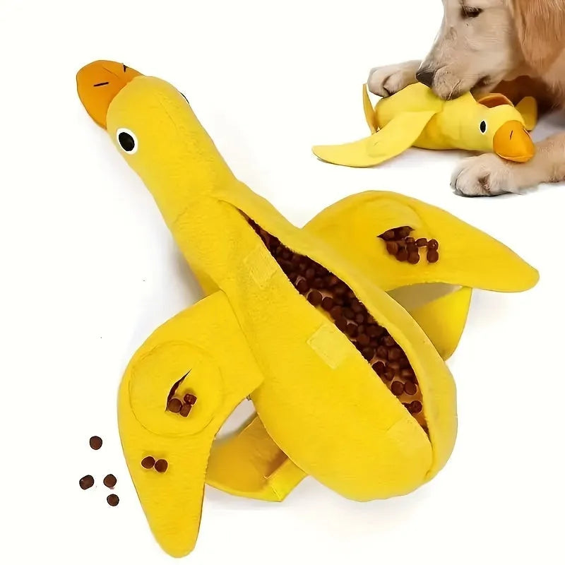 Yellow teddy dog training toy with integrated duck doll and food leak design for scent work