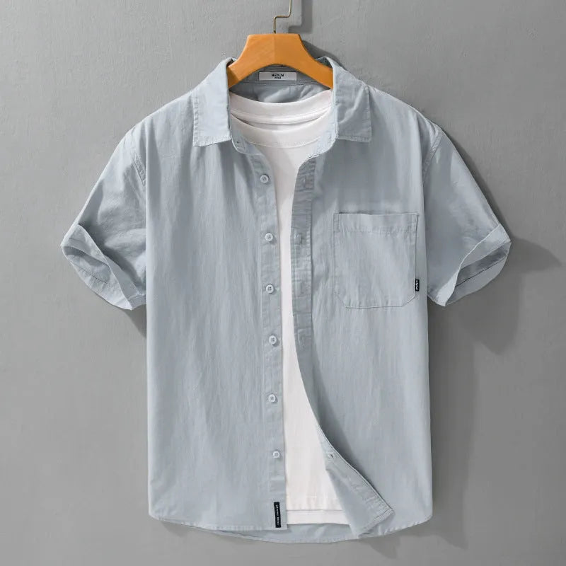Men's loose-fit pure cotton short sleeve shirt in light blue, showing casual cardigan style.