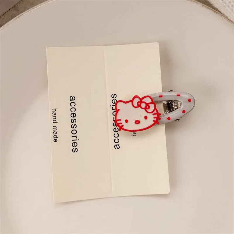 Red love heart-shaped plastic hair clip with retro dots and a willow leaf silhouette on a white background.
