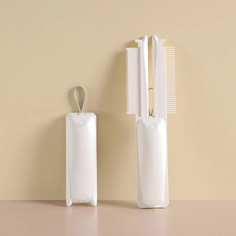 Pink and white ABS plastic pet grooming brush for dogs and cats on flat surface