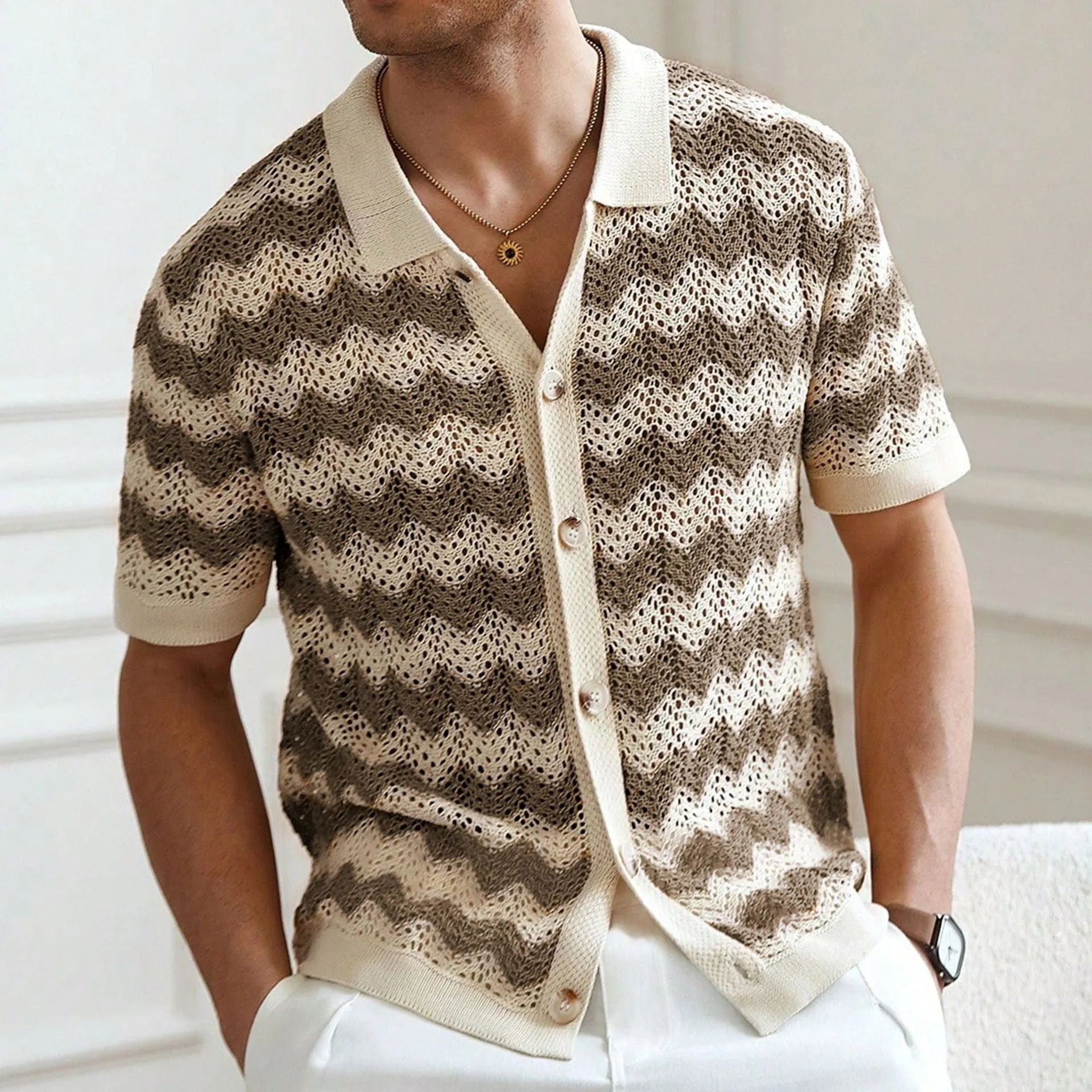 Blue hollow jacquard corrugated short sleeve sweater with flocked detail on a hanger.