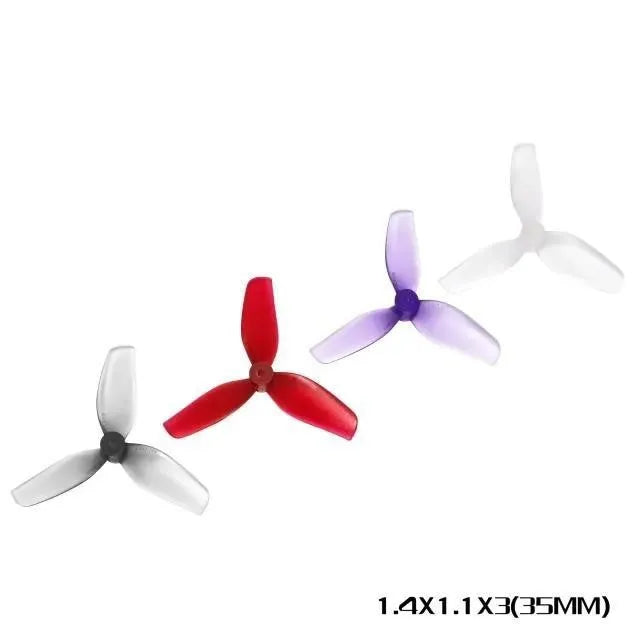 Set of four 31mm 3-blade PC propeller blade accessories in clear, gray, purple, and red on white background