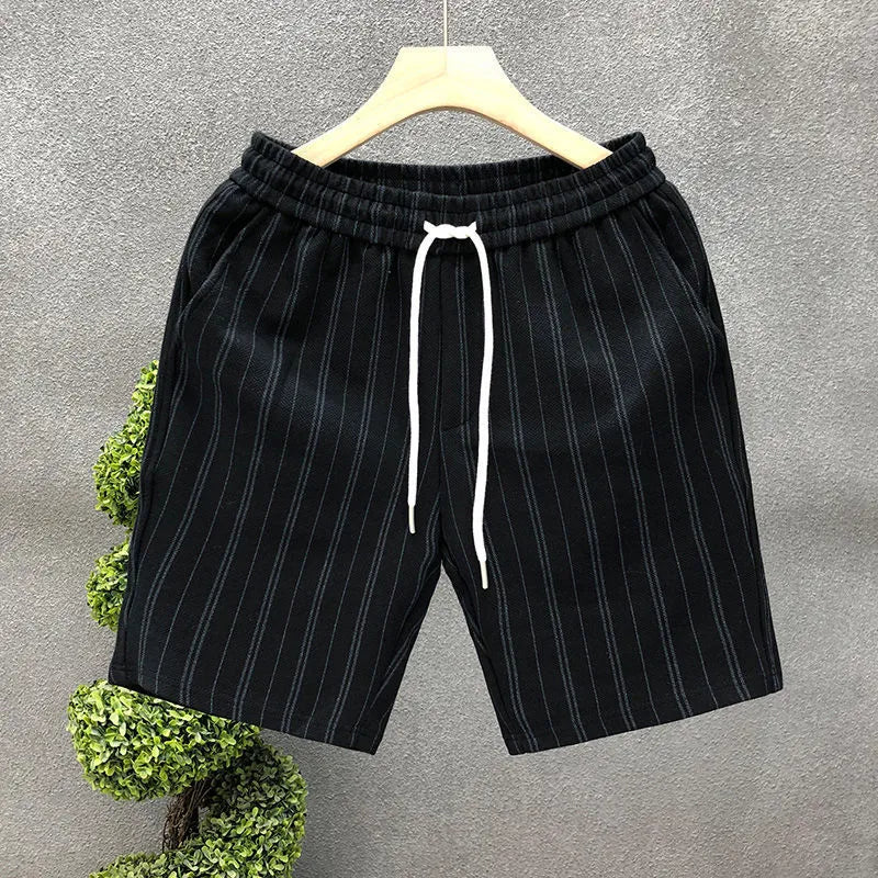 Men's black and white striped fleece-lined casual shorts with elastic waistband