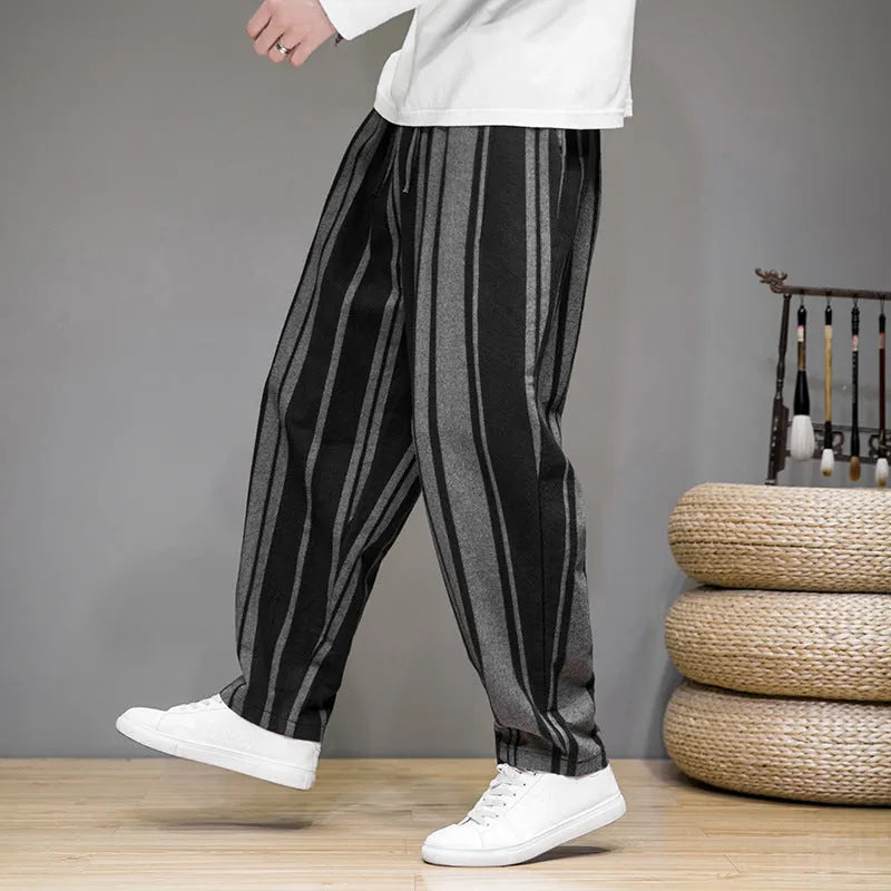 Men's striped casual trousers in black and navy blue options showing mid waist design